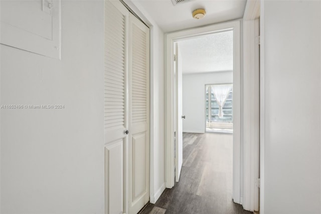 hall with dark hardwood / wood-style flooring