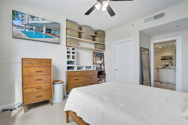 bedroom featuring a ceiling fan, light tile patterned floors, visible vents, and ensuite bathroom