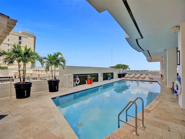 community pool with a patio