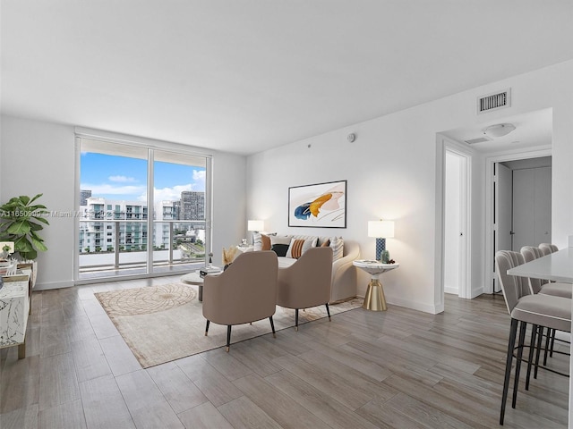 living room with light hardwood / wood-style floors