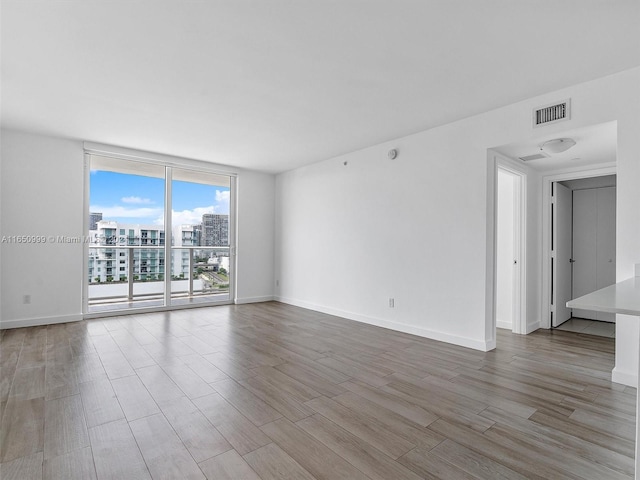 empty room featuring hardwood / wood-style floors