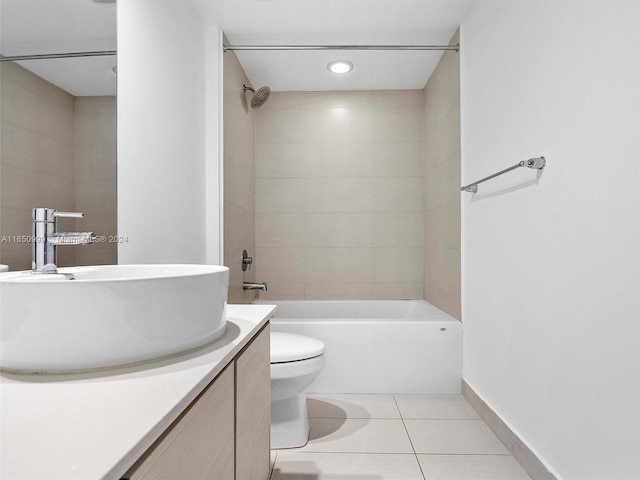 full bathroom featuring vanity, tiled shower / bath combo, toilet, and tile patterned floors