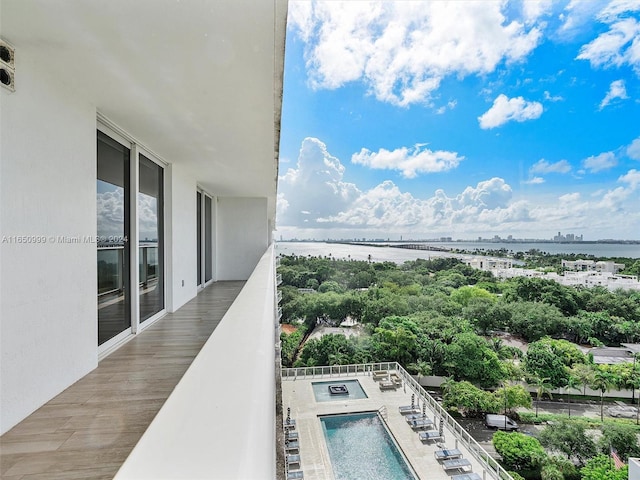 balcony featuring a water view