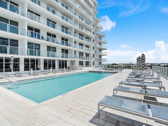 view of pool featuring a patio