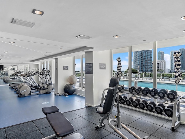 exercise room with floor to ceiling windows