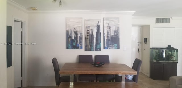 dining room featuring ornamental molding