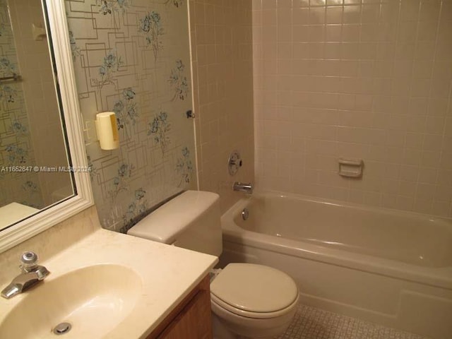 full bathroom with shower / tub combination, tile patterned flooring, toilet, and vanity