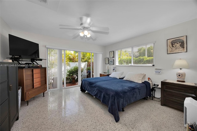 bedroom featuring ceiling fan and access to exterior