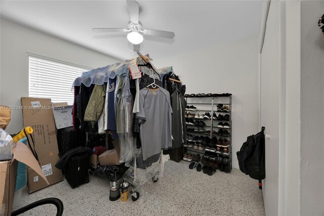 spacious closet with ceiling fan