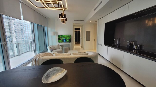 interior space with sink, a wealth of natural light, and electric panel