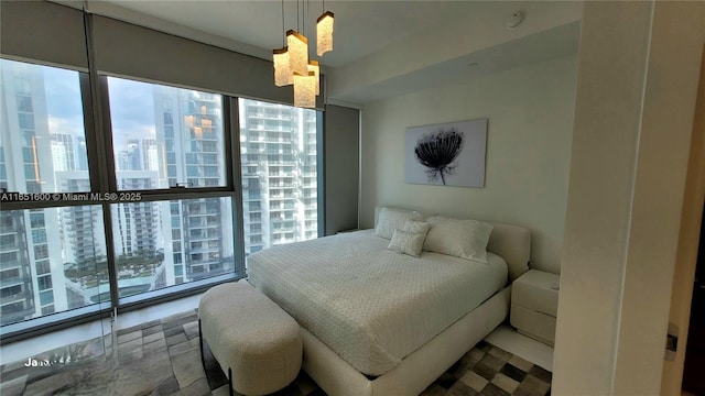 bedroom with floor to ceiling windows