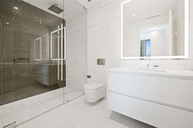 bathroom with vanity, toilet, and a tile shower