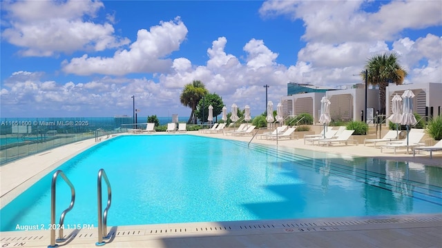 view of swimming pool featuring a patio area