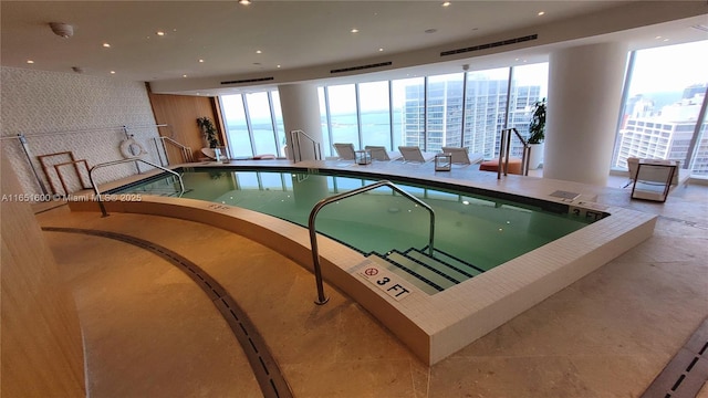 view of swimming pool with a jacuzzi