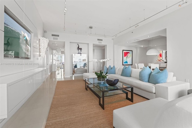 living area featuring recessed lighting, visible vents, and light tile patterned flooring