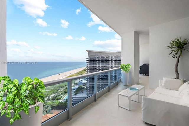 balcony with a view of the beach and a water view