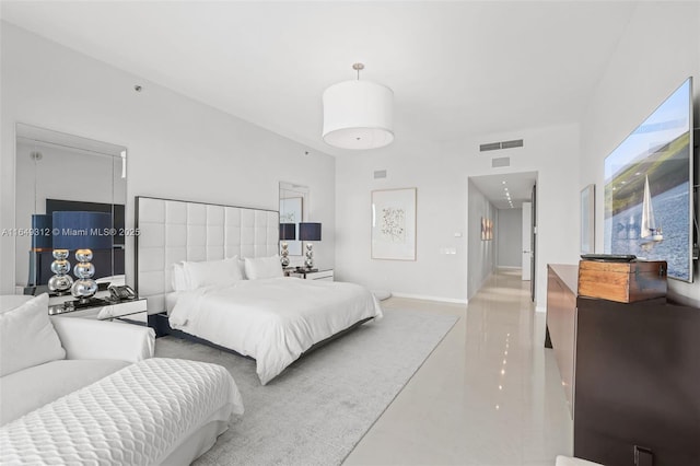 bedroom with visible vents and baseboards