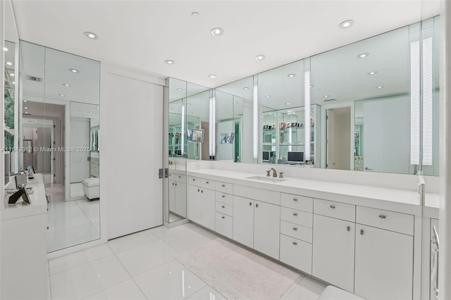 full bathroom featuring recessed lighting, washer / clothes dryer, vanity, and tile patterned floors