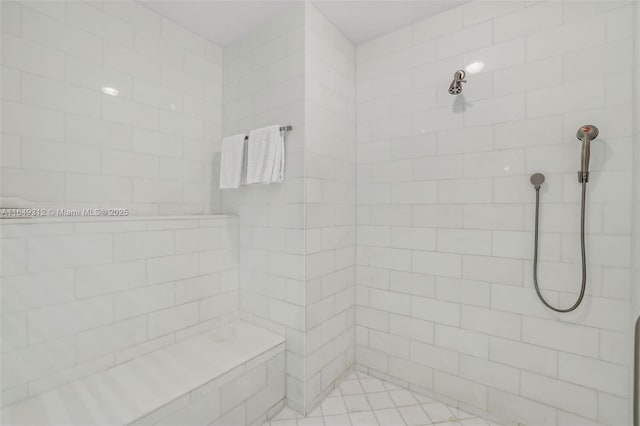 bathroom featuring tiled shower