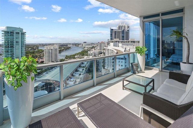 balcony with a city view and a water view