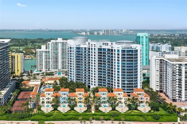 aerial view featuring a view of city and a water view