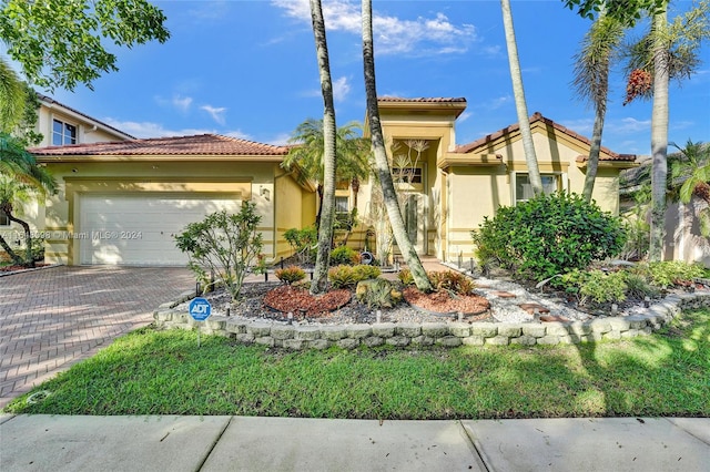 mediterranean / spanish-style home featuring a garage