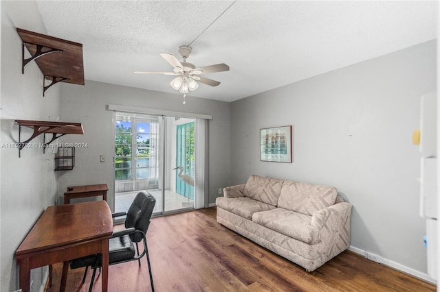 office area featuring a textured ceiling, hardwood / wood-style flooring, and ceiling fan