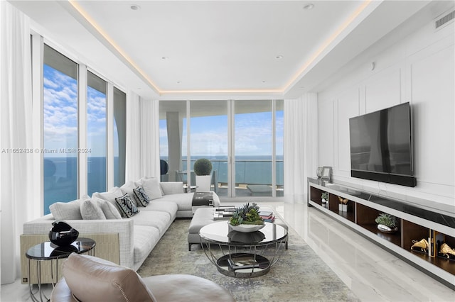 dining space featuring a notable chandelier and a water view