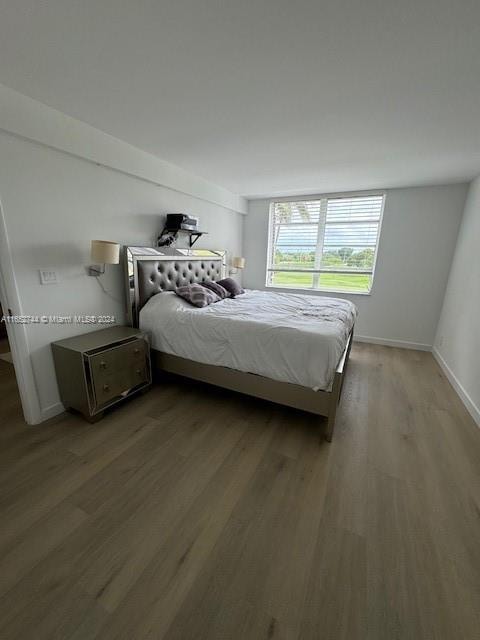 bedroom featuring hardwood / wood-style flooring