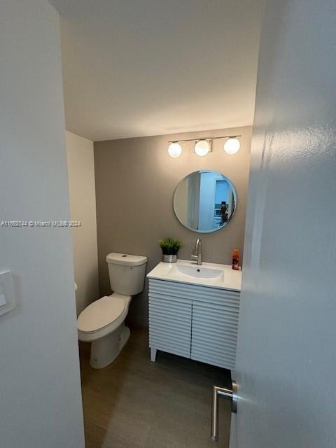 bathroom with vanity and toilet