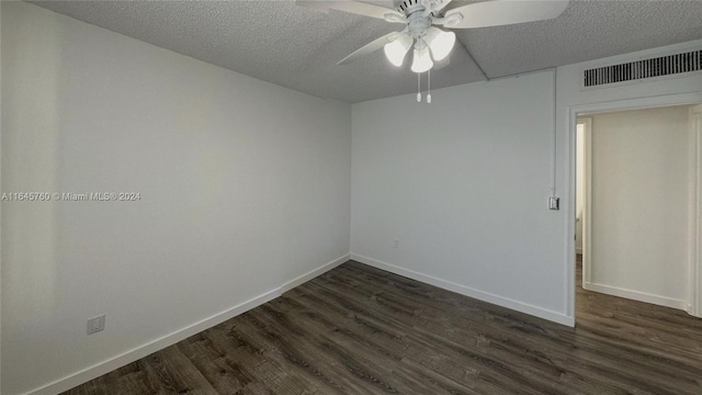 empty room featuring dark hardwood / wood-style floors, a textured ceiling, and ceiling fan