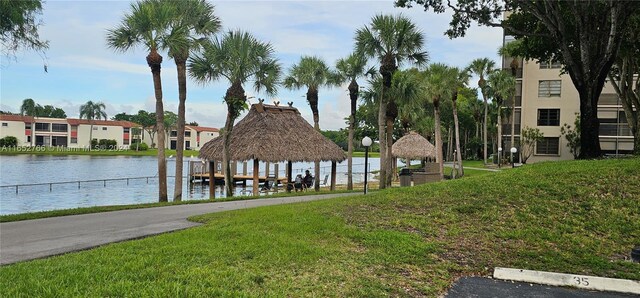 exterior space with a water view, a lawn, and a gazebo