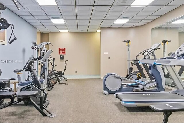 exercise room featuring a paneled ceiling