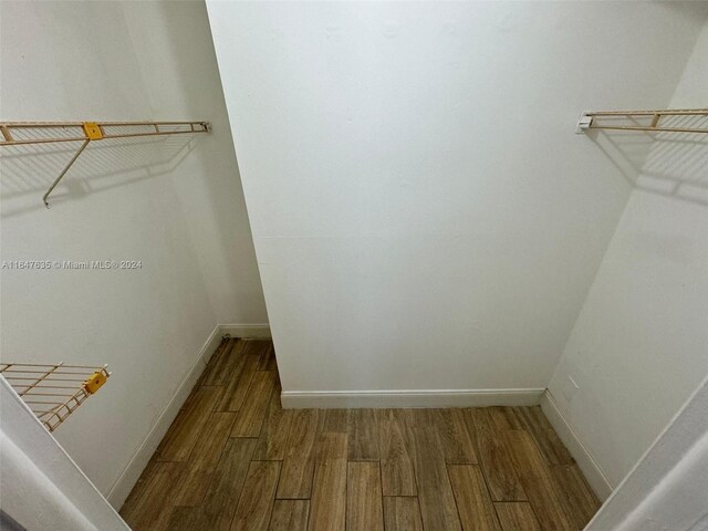 walk in closet featuring hardwood / wood-style floors