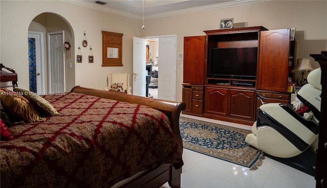 bedroom featuring visible vents, arched walkways, and crown molding