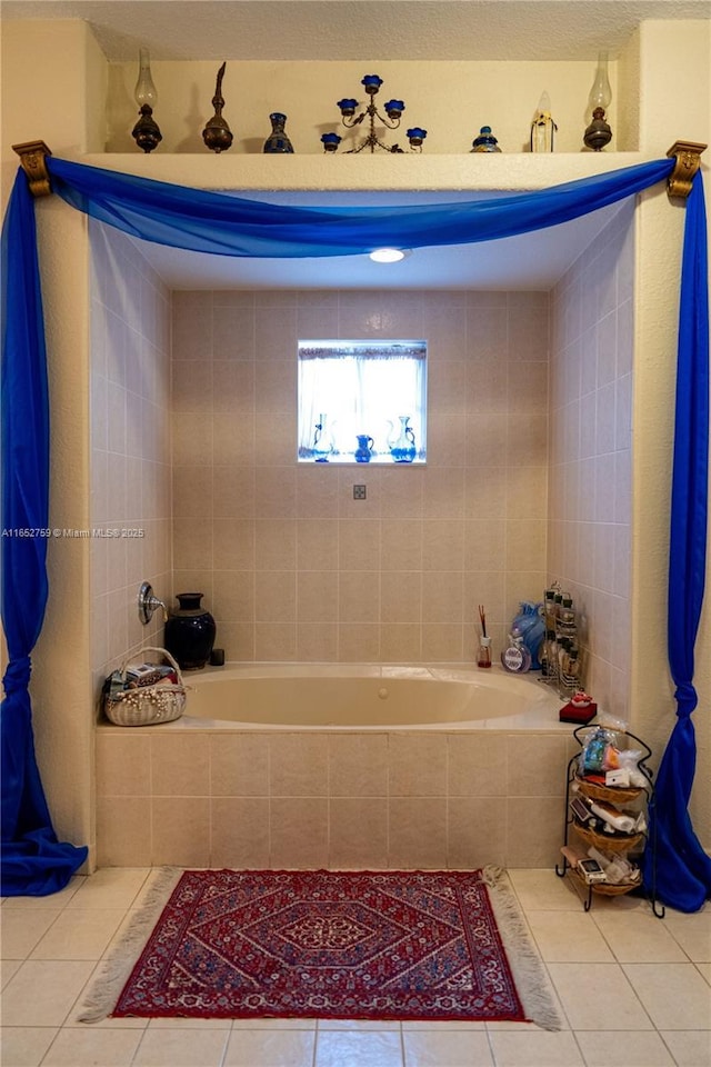 bathroom featuring a relaxing tiled tub and tile patterned floors