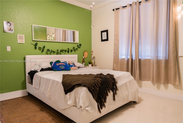 bedroom featuring baseboards and crown molding