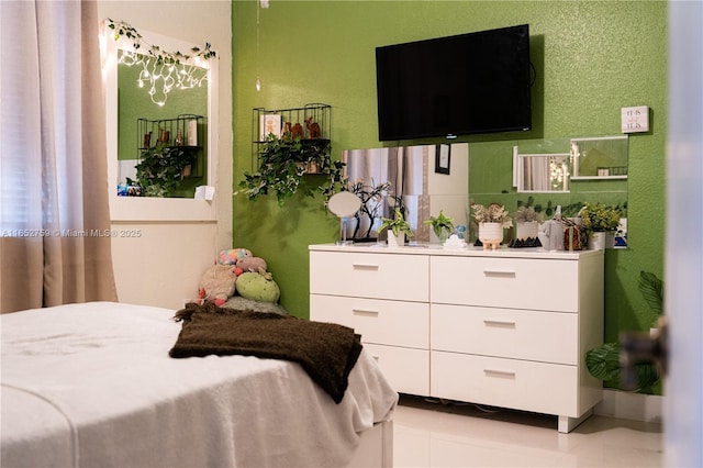 bedroom with light tile patterned floors