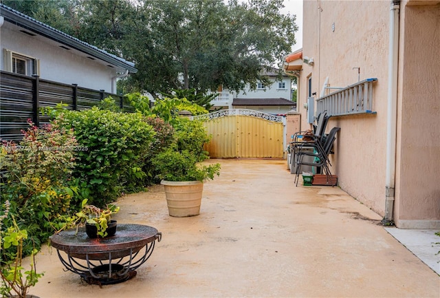 view of patio / terrace with a gate and fence