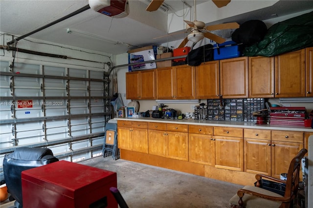 garage featuring ceiling fan and a garage door opener