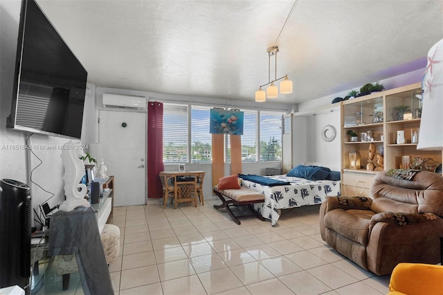 living room featuring a textured ceiling, a wall unit AC, and light tile patterned flooring