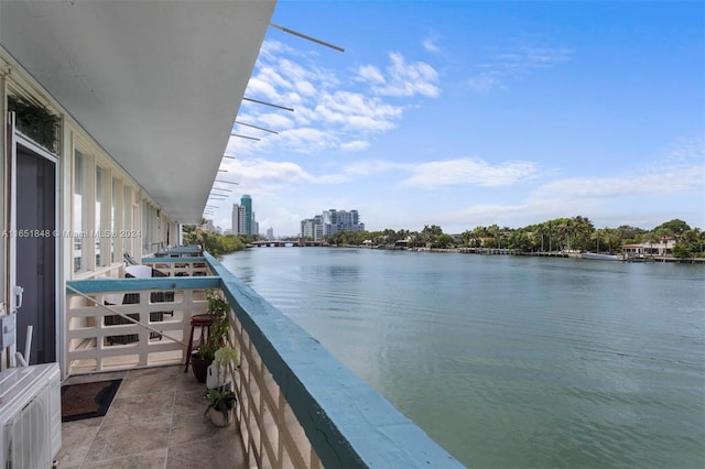 balcony with a city view and a water view