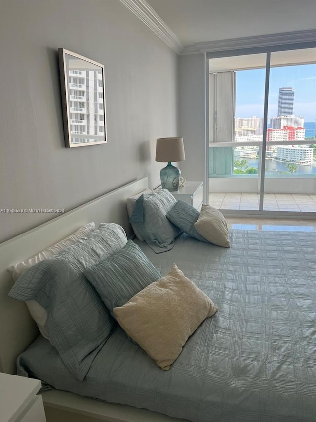 bedroom featuring access to exterior and ornamental molding