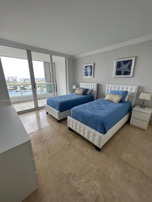 bedroom featuring crown molding and access to exterior