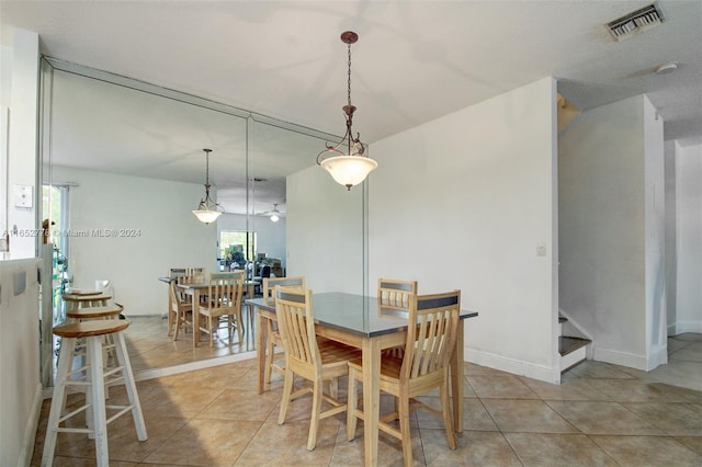 dining space with light tile patterned floors