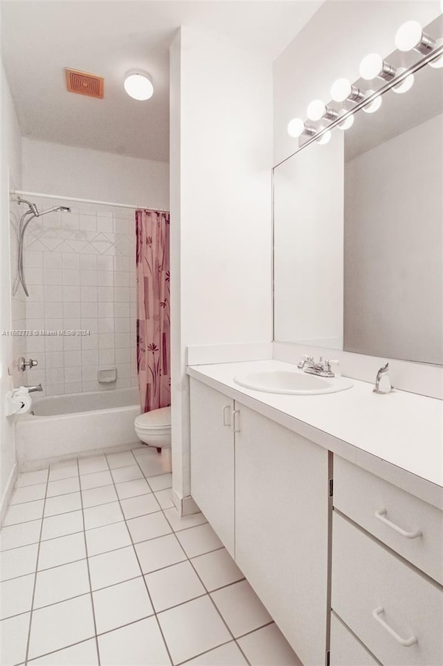 full bathroom featuring tile patterned flooring, toilet, shower / tub combo with curtain, and vanity