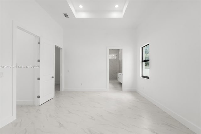 empty room featuring a high ceiling