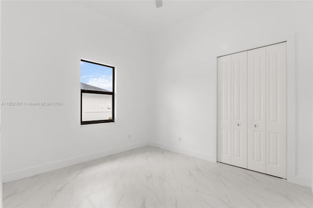 unfurnished bedroom featuring a closet