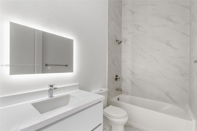 full bathroom featuring vanity, toilet, and tiled shower / bath combo