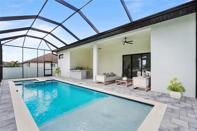 view of swimming pool with a lanai, ceiling fan, area for grilling, and a patio